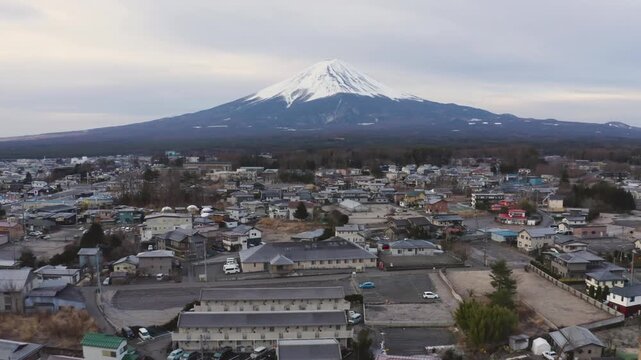 Telephoto View of Mount Fuji Rising Above Forest and Fujikawaguchiko Town