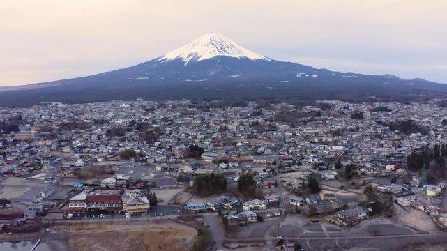 Elevated Telephoto View of Mount Fuji Over Forested Landscape and Fujikawaguchiko