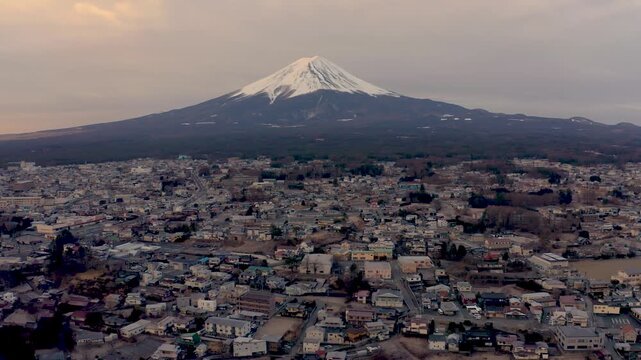 Aerial View of Snow Capped Mount Fuji over Fujikawaguchiko Cityscape