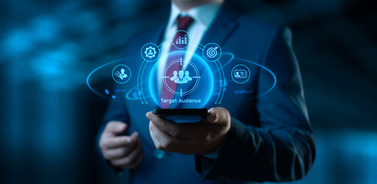 Businessman Holding smartphone with Target Audience Icons on Screen. Digital Marketing and business concept