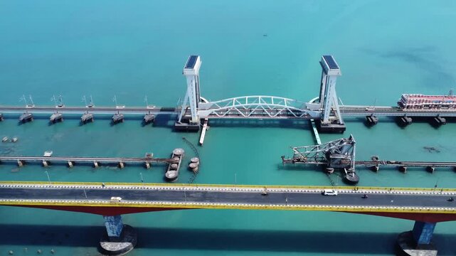 High Angle Aerial View of New Pamban Indian Railway Bridge and Annai Indira Gandhi Road Bridge over Sea Waters. Pamban Railway Bridge and Road Bridge Across Turquoise Palk Strait Waters.