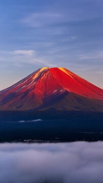 Glowing Red Mount Fuji Sunrise Over Clouds 4K Generative AI