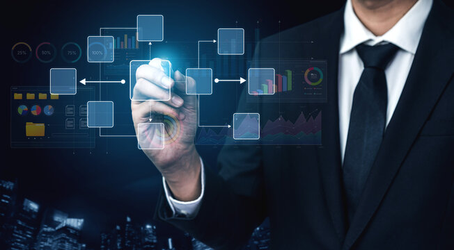 Businessman Presenting Digital Interface with Data Charts and Flow Diagrams in Modern Office Setting for Innovation and Technology Concept. Bitwise.