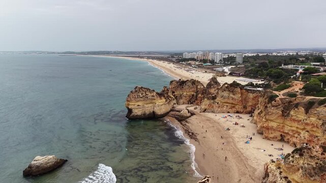 Aerial view of alvor's three brothers beach coastline in portugal