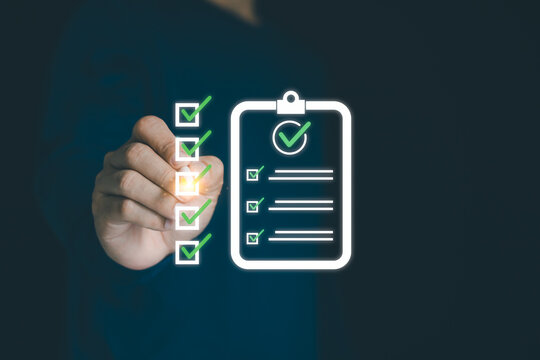 Businessman using a digital online checklist survey, filling out digital form checklist. Take assessment, questionnaire, evaluation, online survey, online exam. Business performance checklist concept