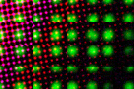 Glowing Green LED Dot Pattern with Blue and Orange Lights on Black Background 