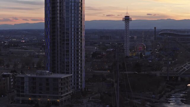 Aerial cityscape of denver, colorado, with downtown skyscrapers highways and bridge with power lines