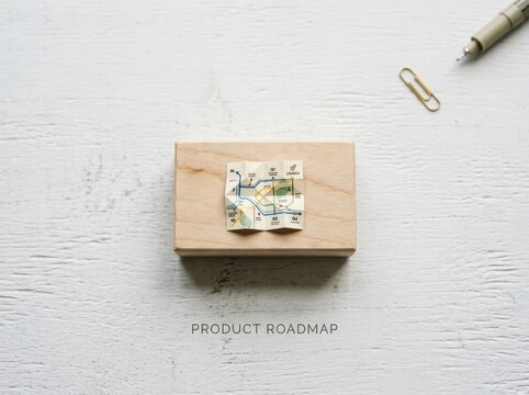Wooden block with map representing business product roadmap