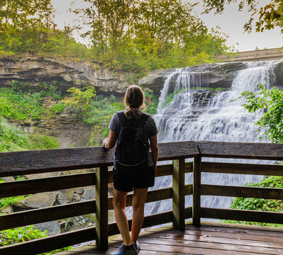 Female Hiker on The Lower Viewing Platform at Brandywine Falls, Cuyahoga Valley National Park, Ohio, USA