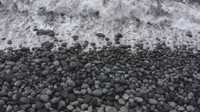 Drone shot, from above, coast with large round stones in Rocha da Relva, Sao Miguel Island, Azores, Portugal