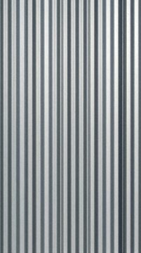 Corrugated metal paneling texture creates a repeating vertical pattern. Silver gray ribbed surface offers a modern industrial or rustic building material background for design.