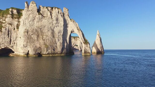 Aerial view, flight through the distinctive Porte d'Aval rock gate in the morning sun, a landmark on the chalk coast, behind the La Manneporte rock gate, Alabaster Coast, La C&ocirc;te d'Alb&acirc;tre, chalk c