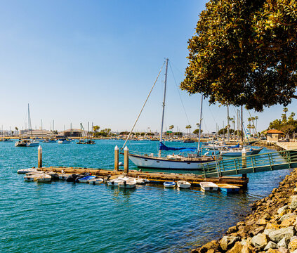 Several Dinghies at The Small Boat Dock With Saliboats Moored Across San Diego Bay, San Diego, California, USA