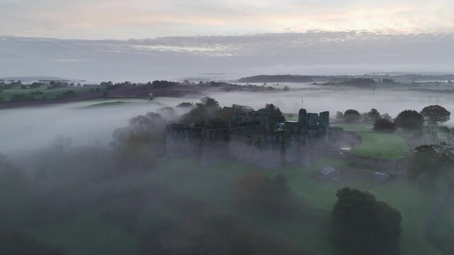 Raglan Castle in the fog at dawn, Monmouthshire, Wales, England, United Kingdom