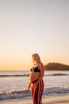 pregnant woman at Manly Beach during sunrise