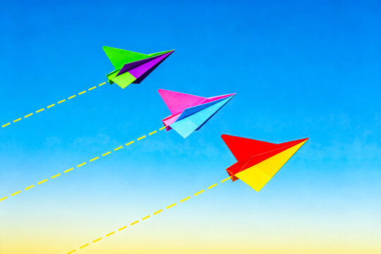 Three Colorful Paper Planes Flying in Clear Blue Sky