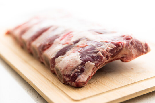 rack of ribs on a chopping board in natural light