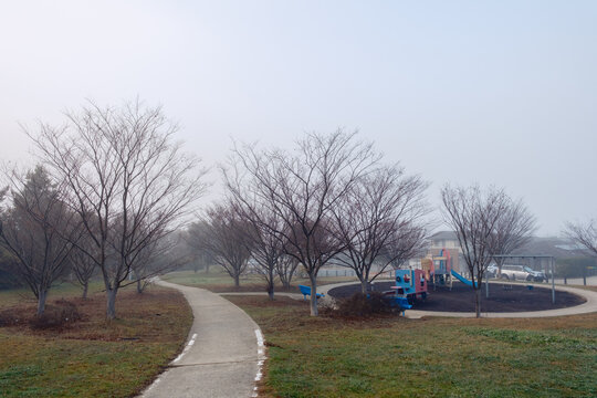 A Cold Foggy Morning in the Suburbs with a Play Ground