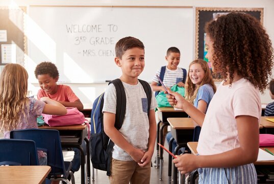 Kids in a classroom on the first day of third grade