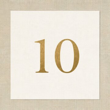A warm cream square displays a gold number ten, representing a decade milestone and highlighting an achievement over ten years