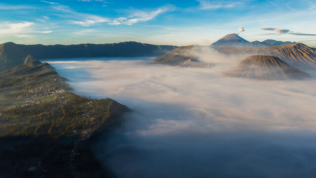 Bromo volcano mountain at sunrise in East Java, Indonesia surrounded by morning fog
