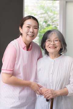 Home care staff who assist with rehabilitation to support the walking of elderly people who use canes; home health aides who provide walking assistance, mobility support, fall prevention, and in-home 
