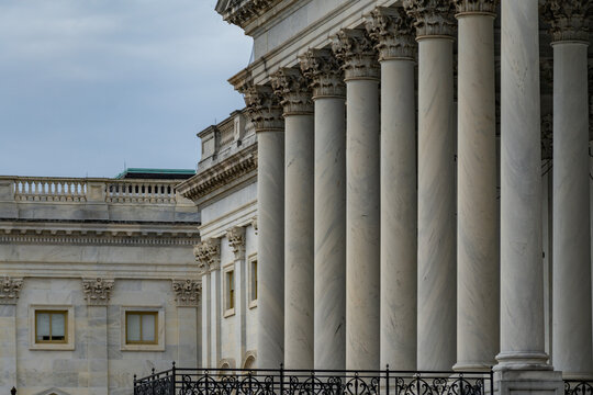 Columns marble fluted Tall vertical architecture. Columns neoclassical facade symmetry pattern. Columns carved capitals decorative ornament. Columns classical Roman Greek structure.