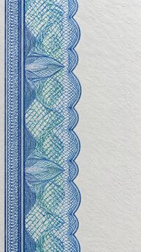 Macro view of a microprinted guilloche security border on blank certificate paper under bright daylight