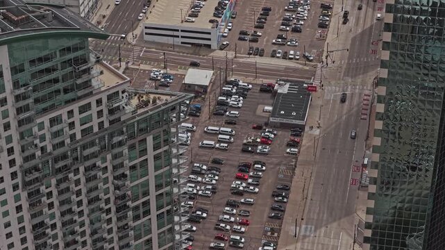 Parking lot bustling with vehicles in a busy urban area  rotating shot drone video denver colorado 4K