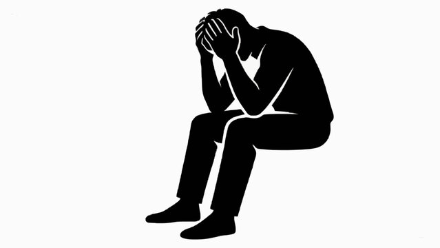 Stressed Person Sitting with Head in Hands Silhouette