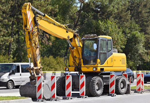 Excavator on highway reconstruction