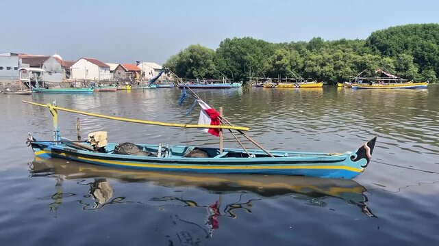 boats on the river east java indonesia