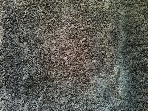Close up dark grey microfiber fabric texture background, soft towel material surface pattern for design and backdrop use in interior