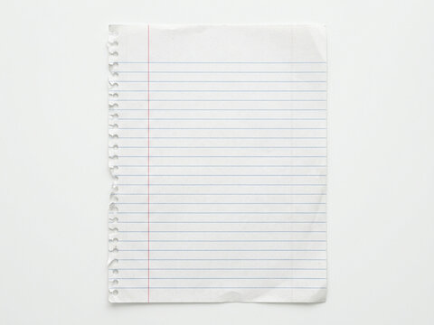 A single piece of torn notebook paper featuring horizontal blue lines and a vertical red margin, captured from above as a handy texture for creative writing or educational projects