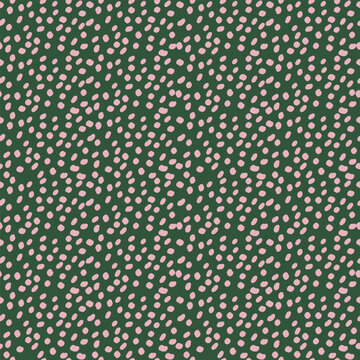 Seamless pattern with hand drawn irregular pink dots on dark green background. Abstract cute spotted texture vector illustration for fabric textile print, wrapping paper, and retro wallpaper design.