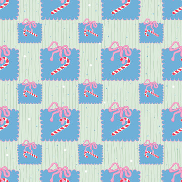 Seamless Christmas pattern with cute blue gift boxes, pink bows and candy cane on pastel green background. Vector illustration for winter holiday fabric textile print, wrapping paper, greeting cards