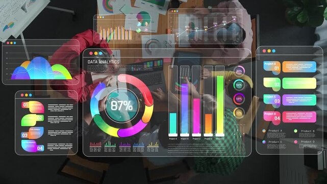 Data analytics and business development meeting with visual charts and graphs displayed on screen in a modern workspace setting Sigmoid
