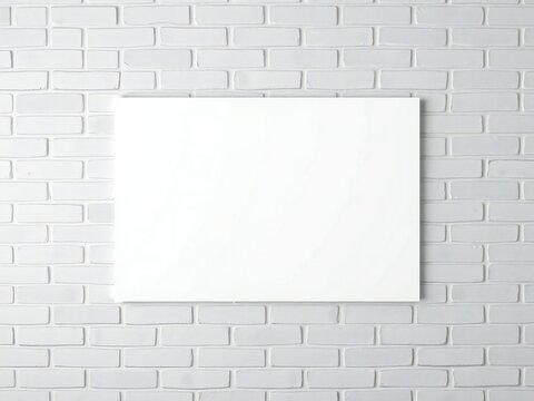 Blank canvas on white brick wall