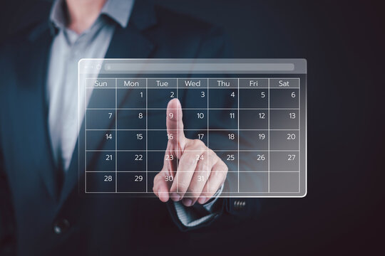 Businessman touching a digital calendar interface, symbolizing scheduling, time management, appointment planning, business organization productivity workflow, deadlines, meetings, and online planning.