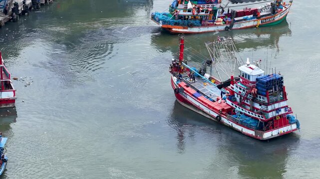 Aerial View of Fishing Boat Navigating Through Polluted River Water