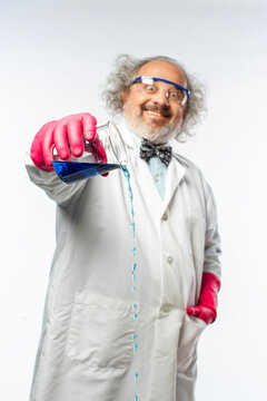 Crazy Mad Scientist Pouring Blue Fluid from a Glass Beaker