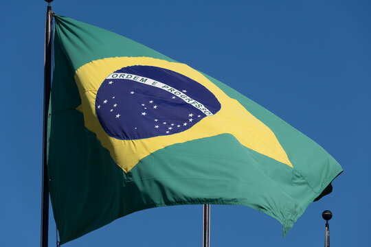 Flag of Brazil fluttering in the wind. In the center of the flag with the words "order and progress" in Portuguese. flag day. proclamation of the Republic. proclama&ccedil;&atilde;o da rep&uacute;blica