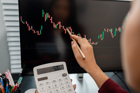 Professional financial market analysis in a modern office, showing investment research, stock market monitoring, technical chart evaluation, and strategic trading decisions for business growth.