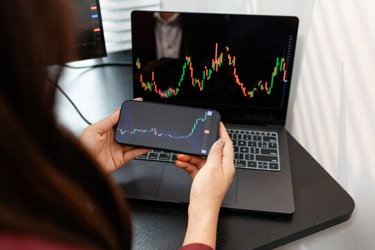 Professional investor monitoring financial markets and analyzing investment opportunities in a modern office, representing stock trading, market research, portfolio management.