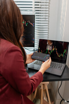 Professional investor monitoring financial markets and analyzing investment opportunities in a modern office, representing stock trading, market research, portfolio management.