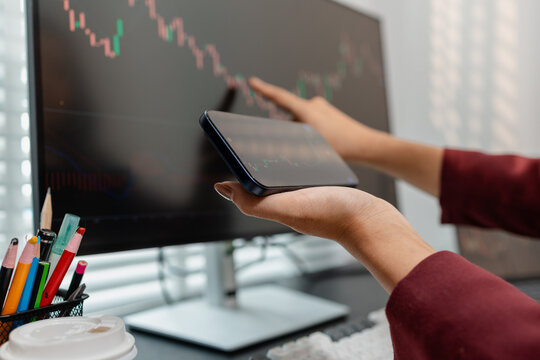 Professional investor monitoring financial markets and analyzing investment opportunities in a modern office, representing stock trading, market research, portfolio management.
