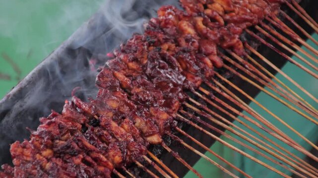 Indonesian Chicken Satay Grilled on Charcoal with Smoke