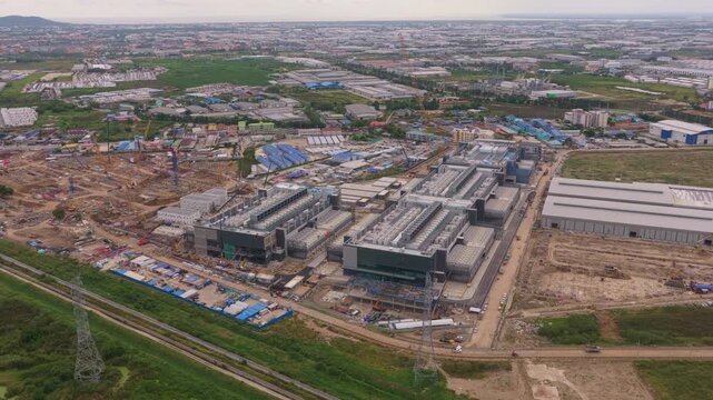 Vast aerial footage showing the construction of a modern hyperscale data center facility for cloud computing and artificial intelligence
