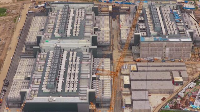 Aerial view tracking the construction progress of a large scale data center facility, a key infrastructure for ai and cloud computing