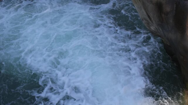 Top View of Churning River Water with White Foam and Rocks